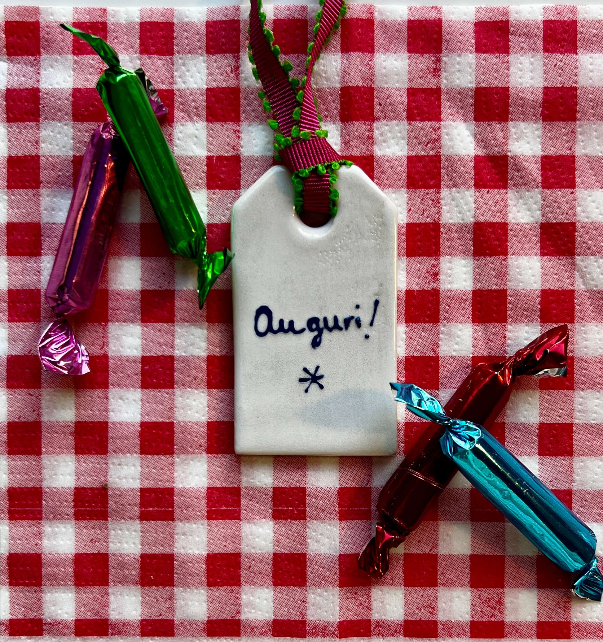 Handmadeceramic lable with writing Auguri by Stefanie Vietor